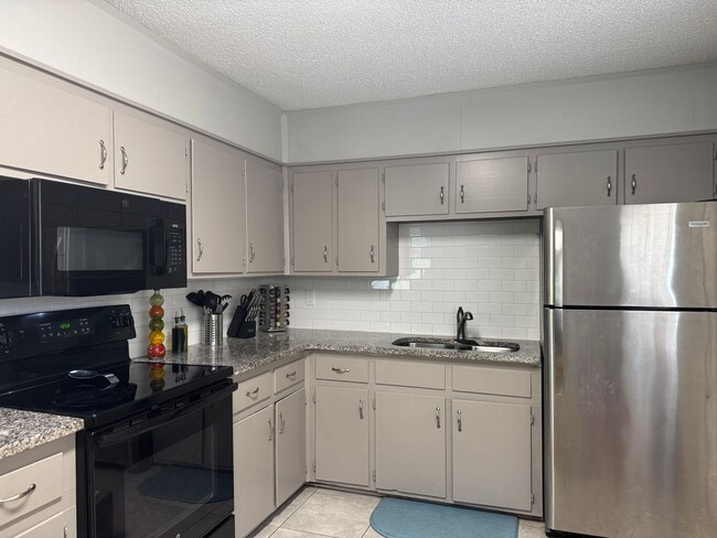 Photo - Spacious 4-Bedroom Home with Den, Fenced Yard & 3-Car Garage. Available Late July!