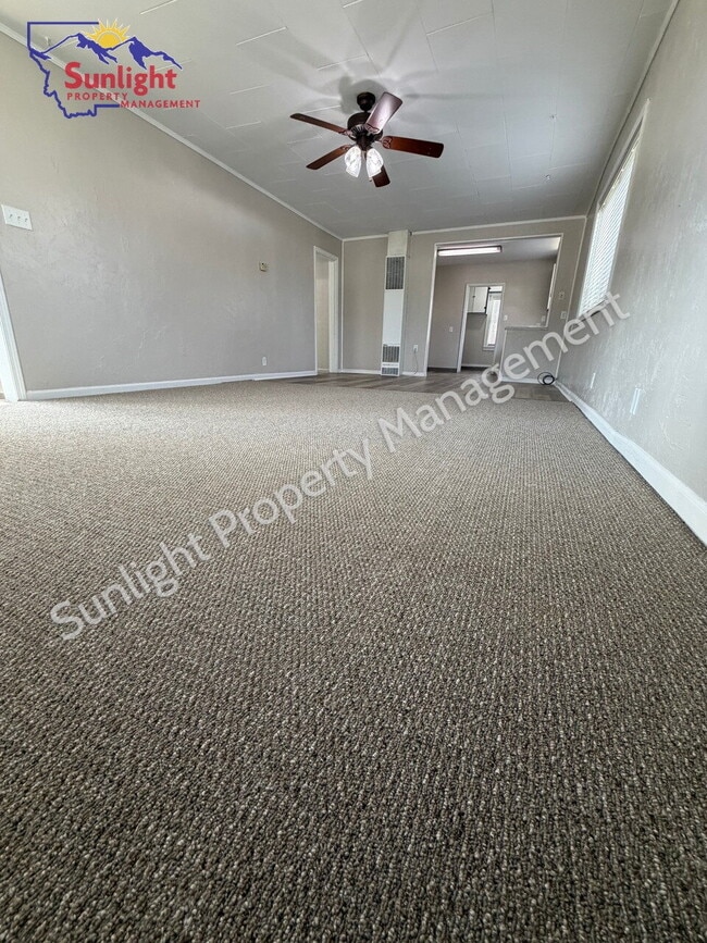 Photo - 2 Bed, 1 Bath Home with Detached Garage, Fenced Yard, and Built-In Storage