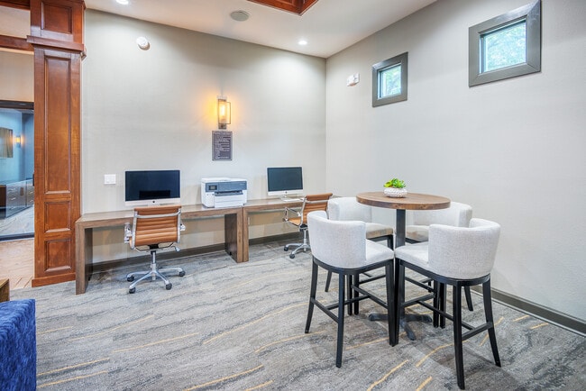Business center with Mac and PC computers