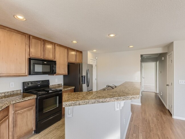 Photo - Evolve Real Estate: Spacious 2 Bed 2 Bath Condo with Attached Garage in Parker!