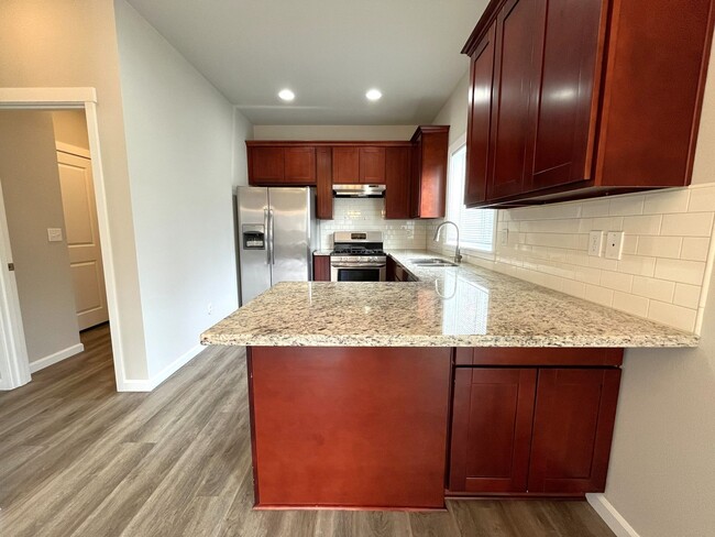 Photo - Well-Appointed 4BR/2.5BA Home with Spacious Living Areas & Modern Kitchen