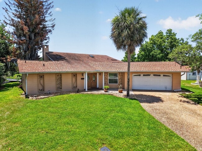 Building Photo - Available Now! Unique Canal-Front Pool Home with Boathouse & Chain of Lakes Access