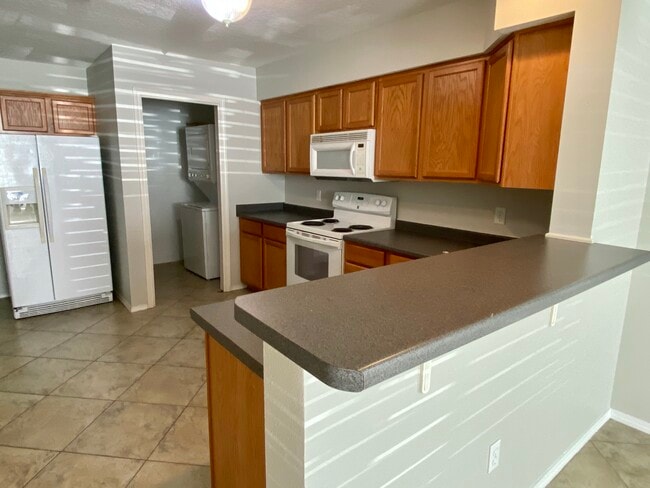 Kitchen looking towards laundry room. - 1819 Shay-Lin Court