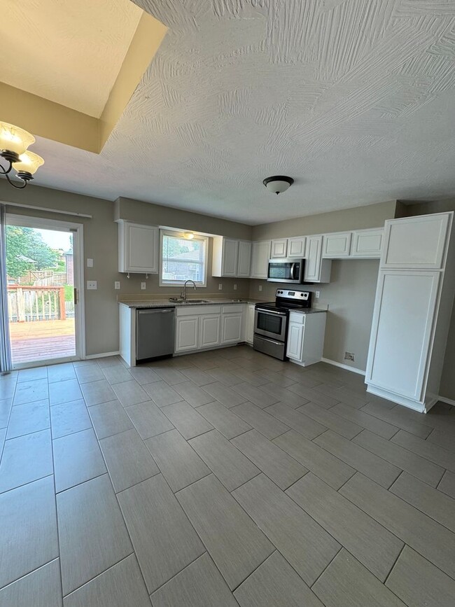 Photo - Beautiful Large corner lot 4 bedroom 3 full bathroom 2 car garage with 3 living rooms and much mo...