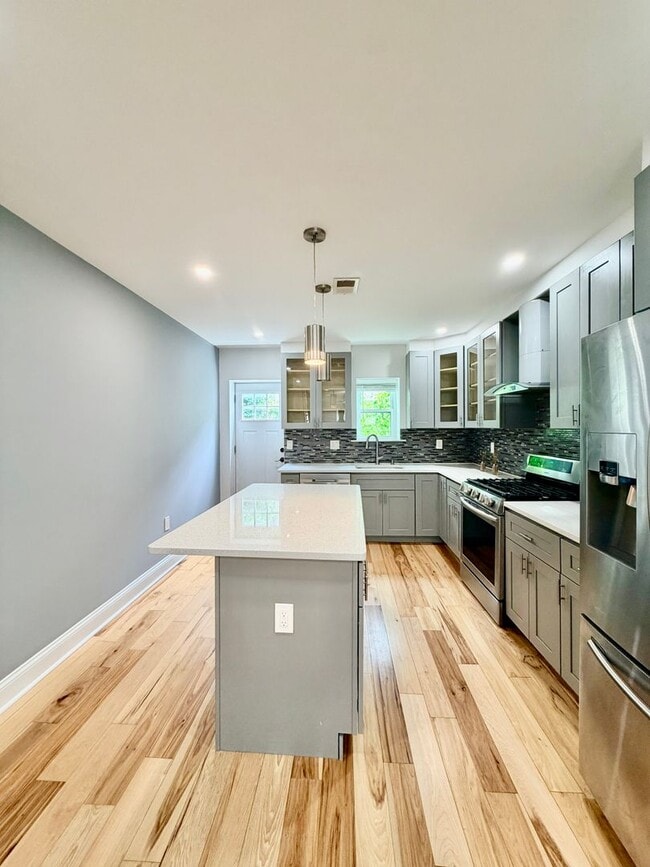 Photo - Modern 3-Bedroom Home with Rooftop Access, Finished Basement & Wet Bar