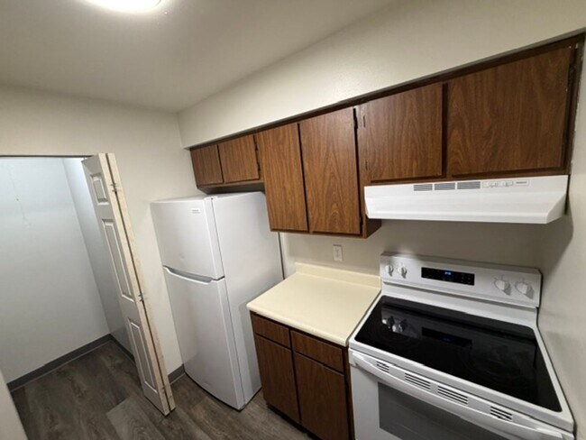 Photo - MOVE-IN Ready - 2 bedroom, One Bath - Top Floor with Private balcony and Central A/C! Unit 30