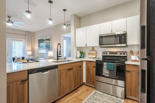 Newly Renovated Kitchen with Stainless Steel Appliances - The Enclave at Tranquility Lake Apartments