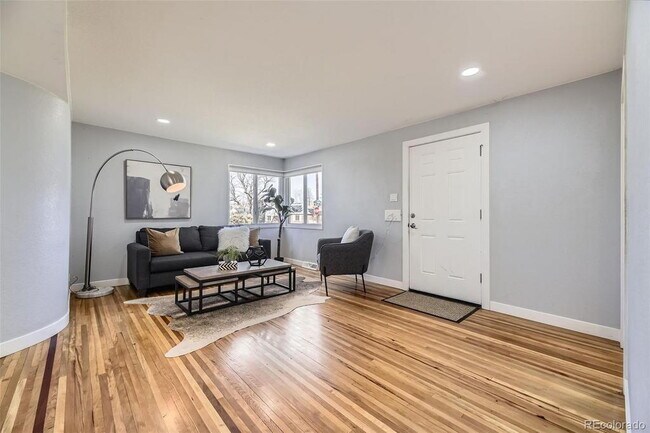 "Charming 3-Bed SFH Denver Gem with Gleaming Hardwood Floors"