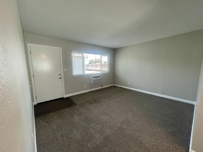 One Bedroom - Living Room - Evart Apartments