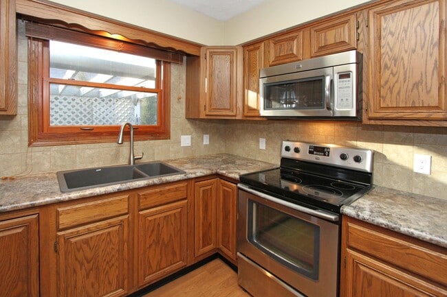 Photo - 2+ Bedroom Ranch Home with Finished Basement, Fenced Yard & Garage- Close to I-80