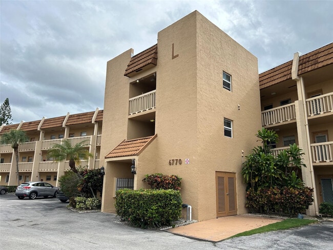 Building Photo - 6770 Royal Palm Blvd Unit 301L