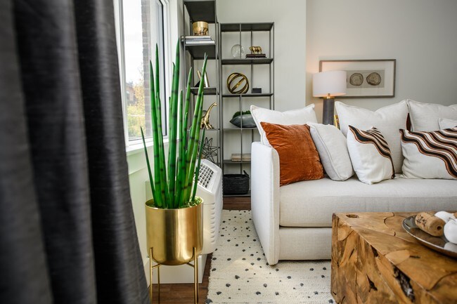 The George Besaw Apartments Model Couch and Window - The George Besaw