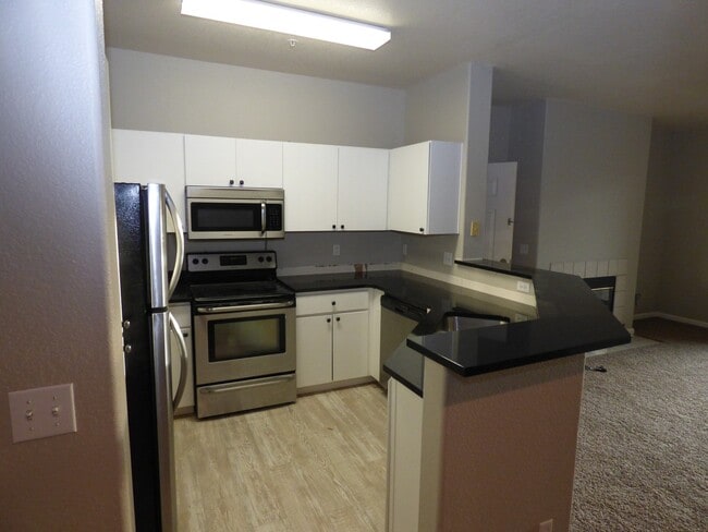 Photo - SOUTHPARK, BEAUTIFUL UPDATES, NEW BLACK GRANITE COUNTERS, NEW CARPET, STAINLESS APPLIANCES, GARAGE! Unit 725