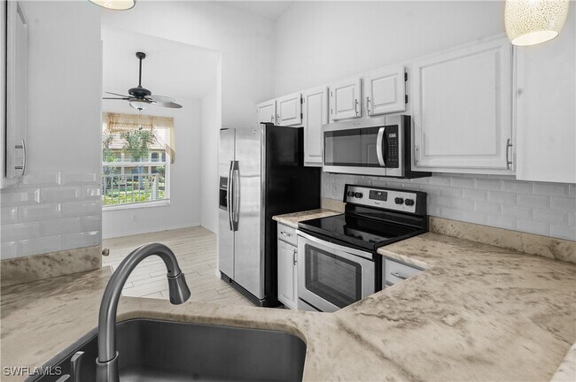 Building Photo - 9851 Costa Mesa Ln Unit 309 Rental