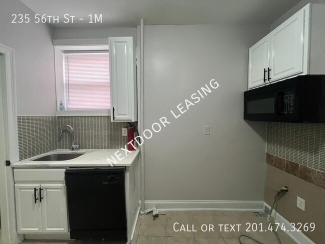 Photo - 235 56th St Unidad 1M
