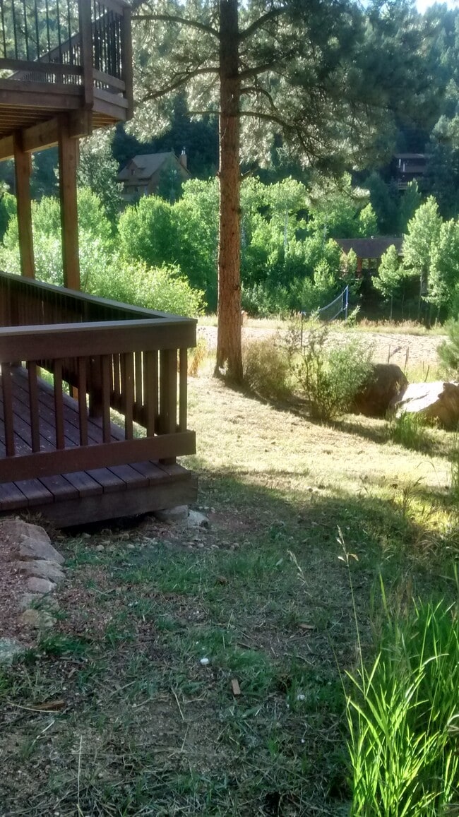 Lower deck with upper deck above sitting on the edge of 200 acres of open space. Small playground and summer volleyball court nearby. - 120 Wisp Creek Dr Unit Valley View ...