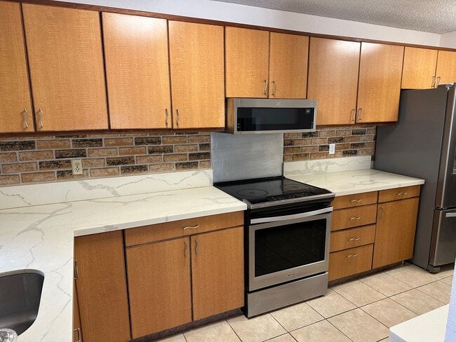 Photo - Spacious 3BR/2BA Split-Level End Unit with Private Courtyard