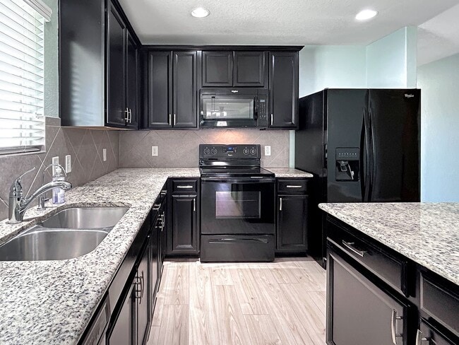 Photo - Far West Side 3BR Home with Study, Island Kitchen & Covered Patio