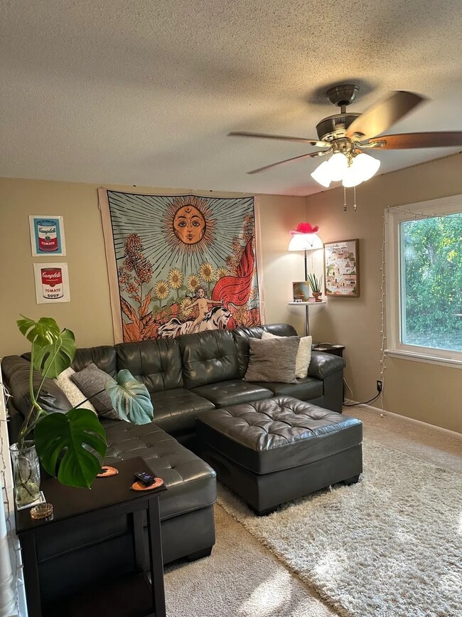 Cozy furnished living room with large window - 1309 Ontario Cir Townhome