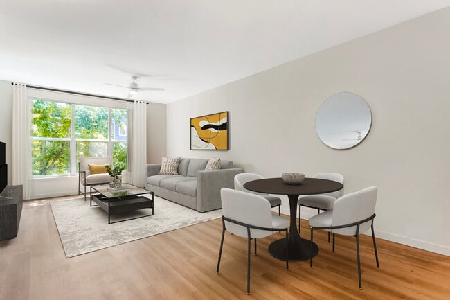 Renovated Package I dining and living room with hard surface flooring (in select homes)