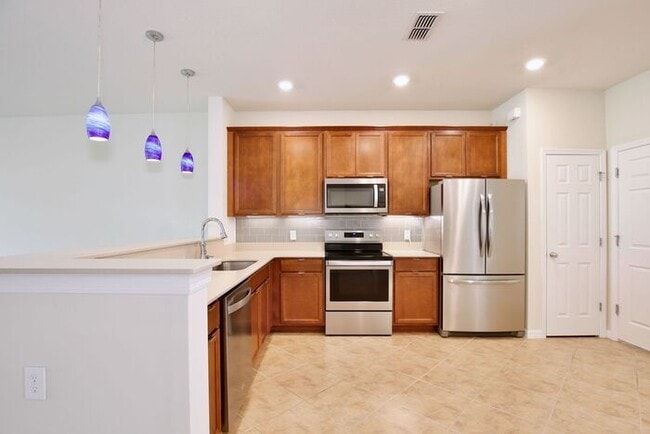 Photo - Immaculate Townhome · Dual En-Suite Bedrooms + Flex Loft · Cable & Internet Included · 3.5 Miles ...