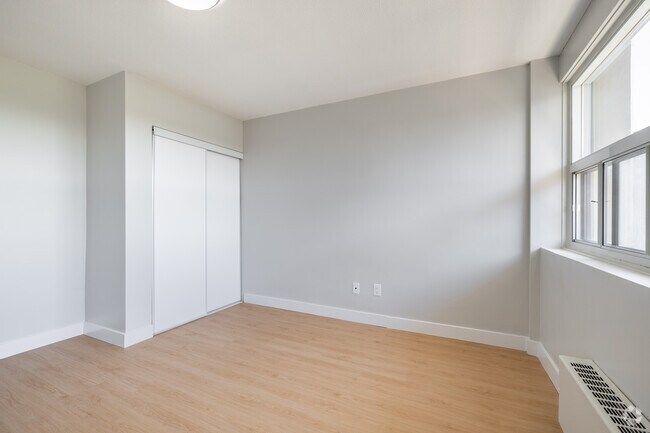 2BR, 1BA - 719SF - Primary Bedroom - Castle Towers