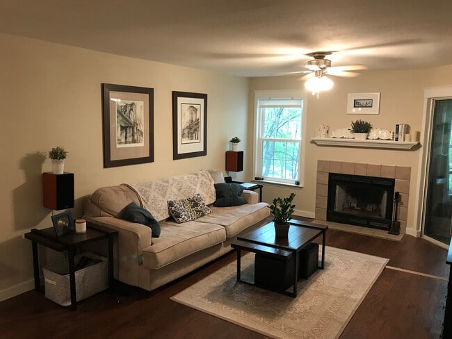 Front Room with Fireplace and view of the trees - 3313 Wyndham Cir Unit 3203