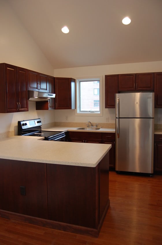 New kitchen with corian countertops.