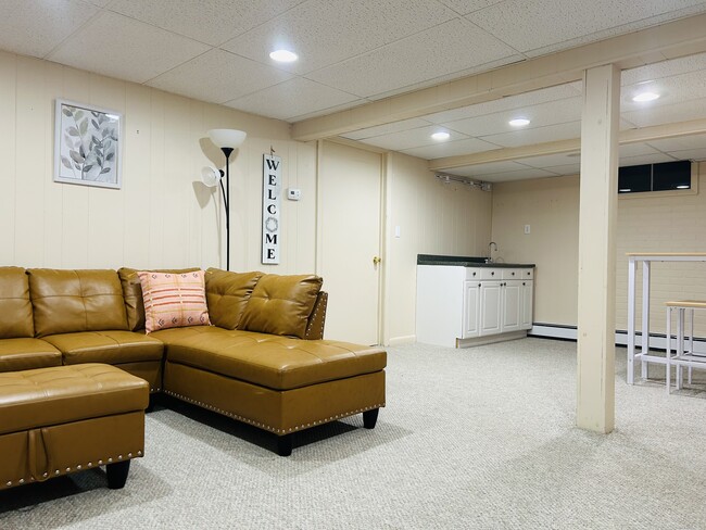 Living room and kitchenette - 12 Graham St Apartments Unit 1 Bd Furnished