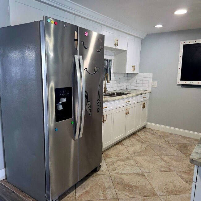 Photo - This gorgeous 2/1 house has been remodeled gourmet chef's kitchen, shaker cabinets, granite count...