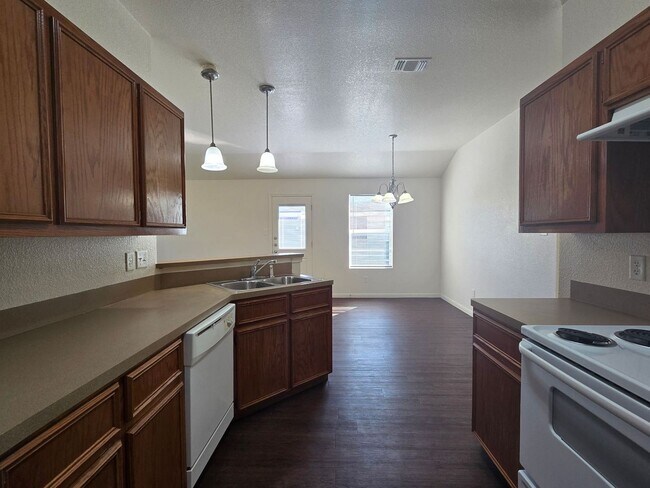 Photo - COMING SOON! Unit 3807 John Chisholm Loop - A