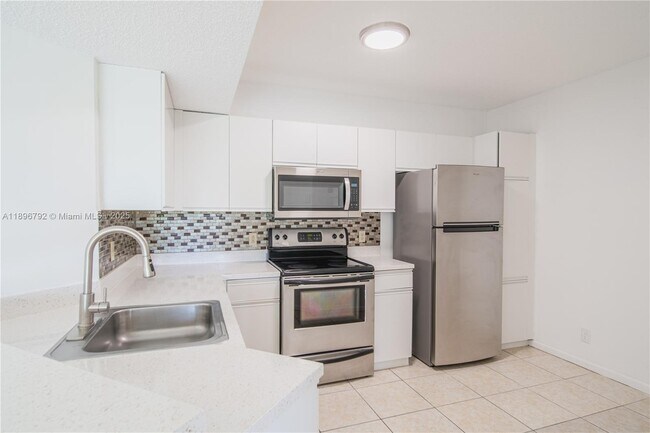 Photo - 9033 Wiles Rd Unit 303