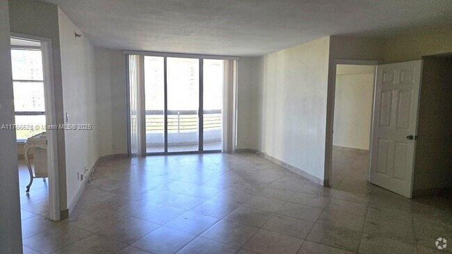 Building Photo - 3600 Mystic Pointe Dr Unit 1209 Rental