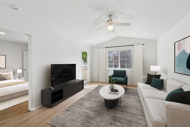 Renovated Package II living room with hard surface flooring