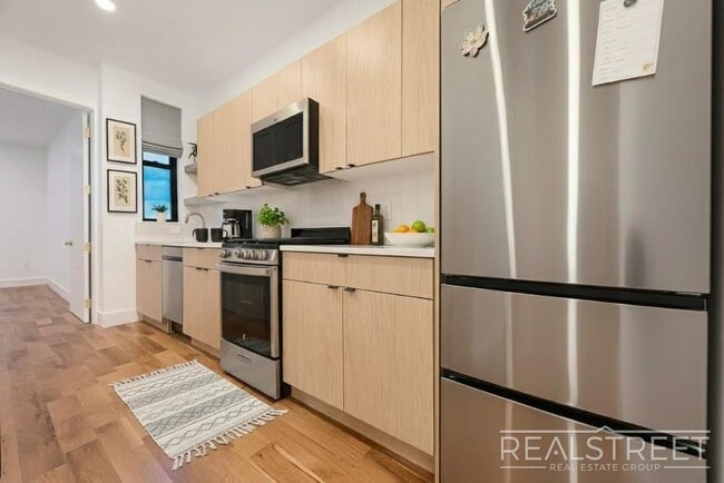 Photo - Modern Renovated 2BR with Skylight & Private Balcony in Prime Crown Heights