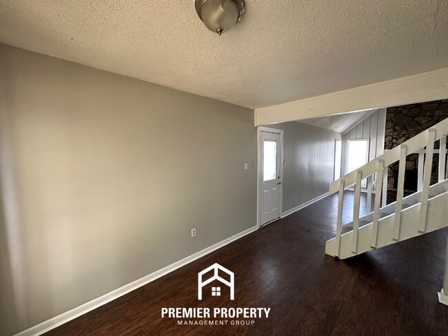 Photo - Beautiful 3BR/2BA Near Southwind | Soaring Vaulted Ceilings, Fireplace & Fenced Yard
