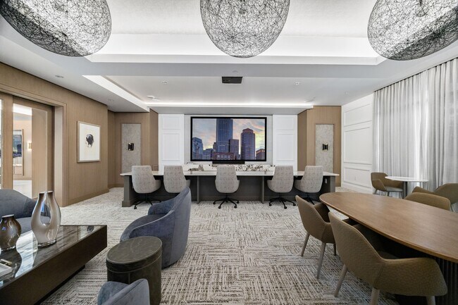 Media lounge with both lounge and theater seating and multiple TVs