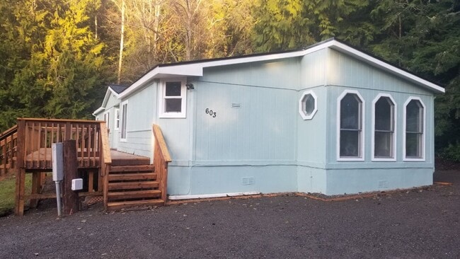 Building Photo - Three bedroom two bath home located on ove...