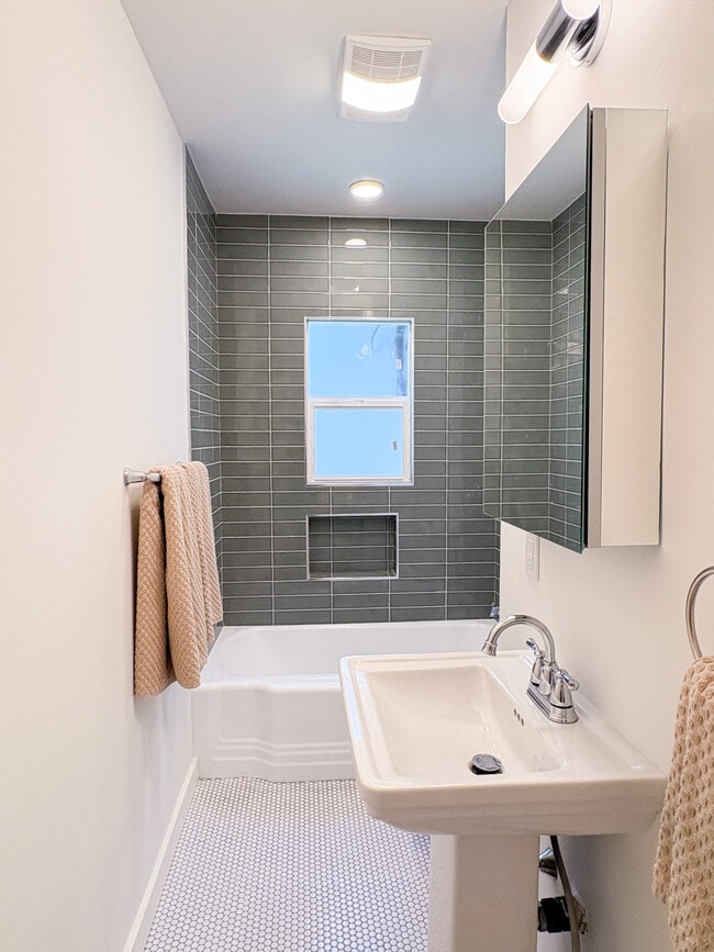 Full bath with original 1950s tub and new tile - 1041 Wilcox Ave Unit 1041
