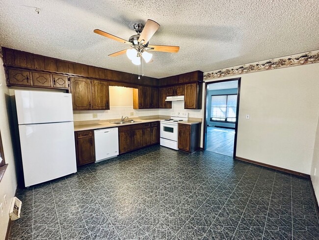 Photo - {1809} Spacious Duplex in Great Blue Springs Location + Finished Basement + 1 Car Garage