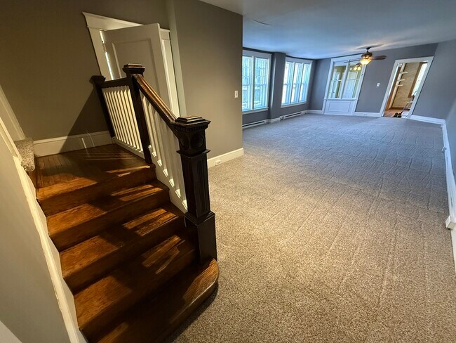 Entry area with living room and steps to bedrooms - 218 E Orange St Unit Apt. 2