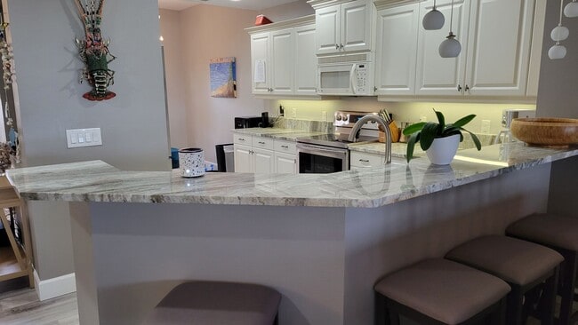 Photo - Annual UNfurnished 2/2 ground floor condo in water front boating community