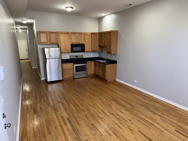 Building Photo - 2438 N Laramie Ave Unit 1North