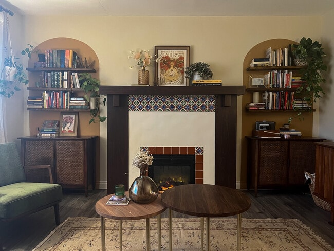 Custom-designed fireplace mantle. Floating shelves. - 620 E Harvard Rd Condo Unit G