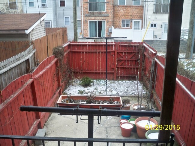 Photo - Charming Locust Point 2bd+Den/1ba Rowhome w/ W/D, CAC and One-Car garage! Available 7/15!