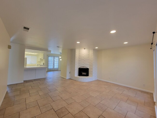 Photo - Condo with open floor plan and a two-car g...