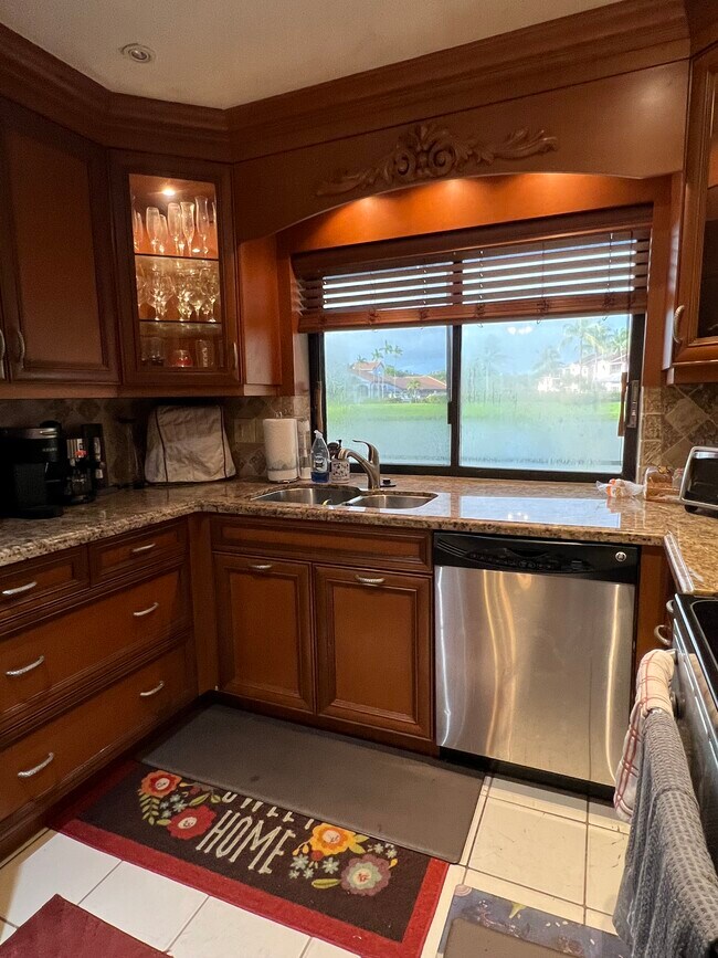 Kitchen overlooks lake - 10664 NW 16th Ct