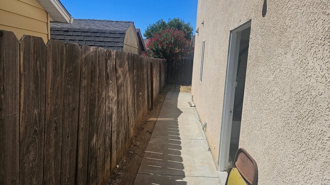 Photo - Three Bedroom Two and a half bath house, 2 car garage, central air. Available now.