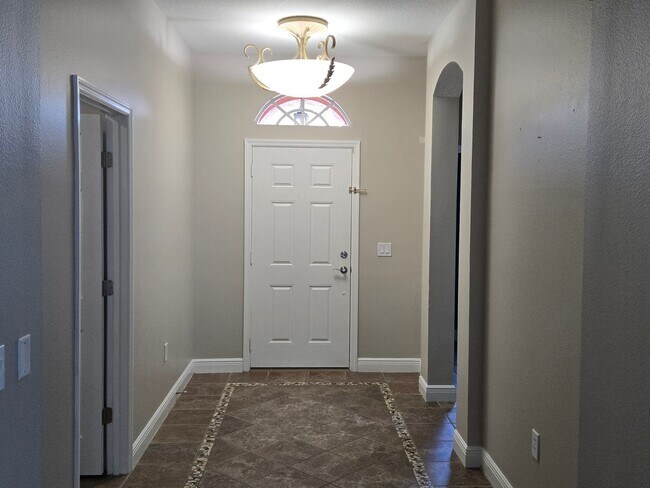 Photo - Freshly Painted 4BR/2BA Pool Home with Screened Pool & Spa – Move-In Ready!