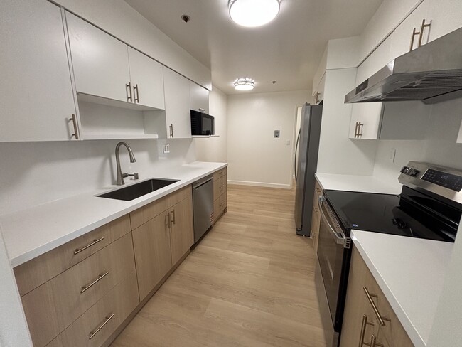 Newly updated kitchen with new cabinets and appliances - 230 W 5th Ave Unit 303